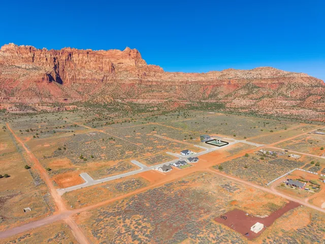 Overview of rural landscape with a desert landscape and a mountain backdrop
