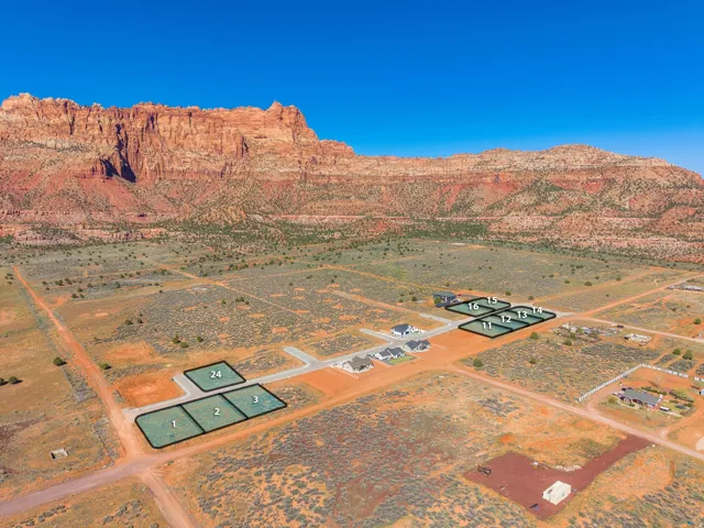Aerial view of sparsely populated area featuring a desert landscape and mountains