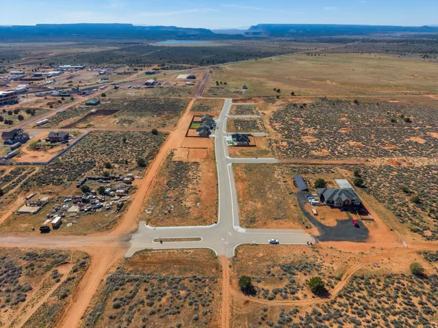 Aerial view of property's location with a mountain backdrop and rural landscape