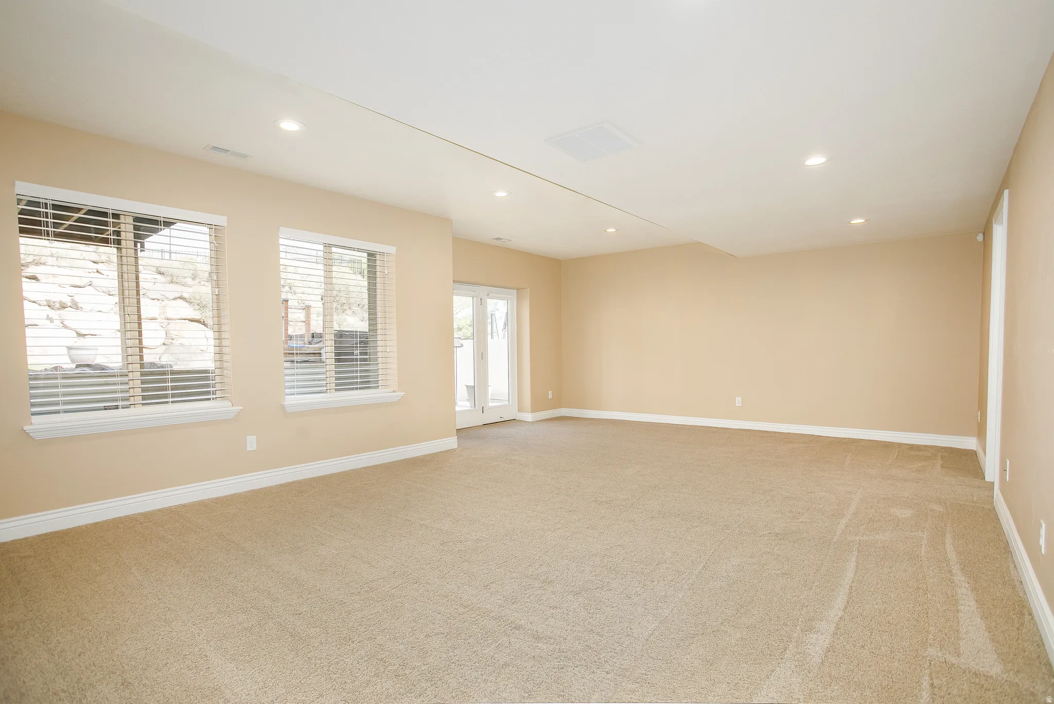 IT'S OWN ENTRANCE!! The sloped back yard really opens up the space. Seriously, look at all that light, no dungeon basements here.