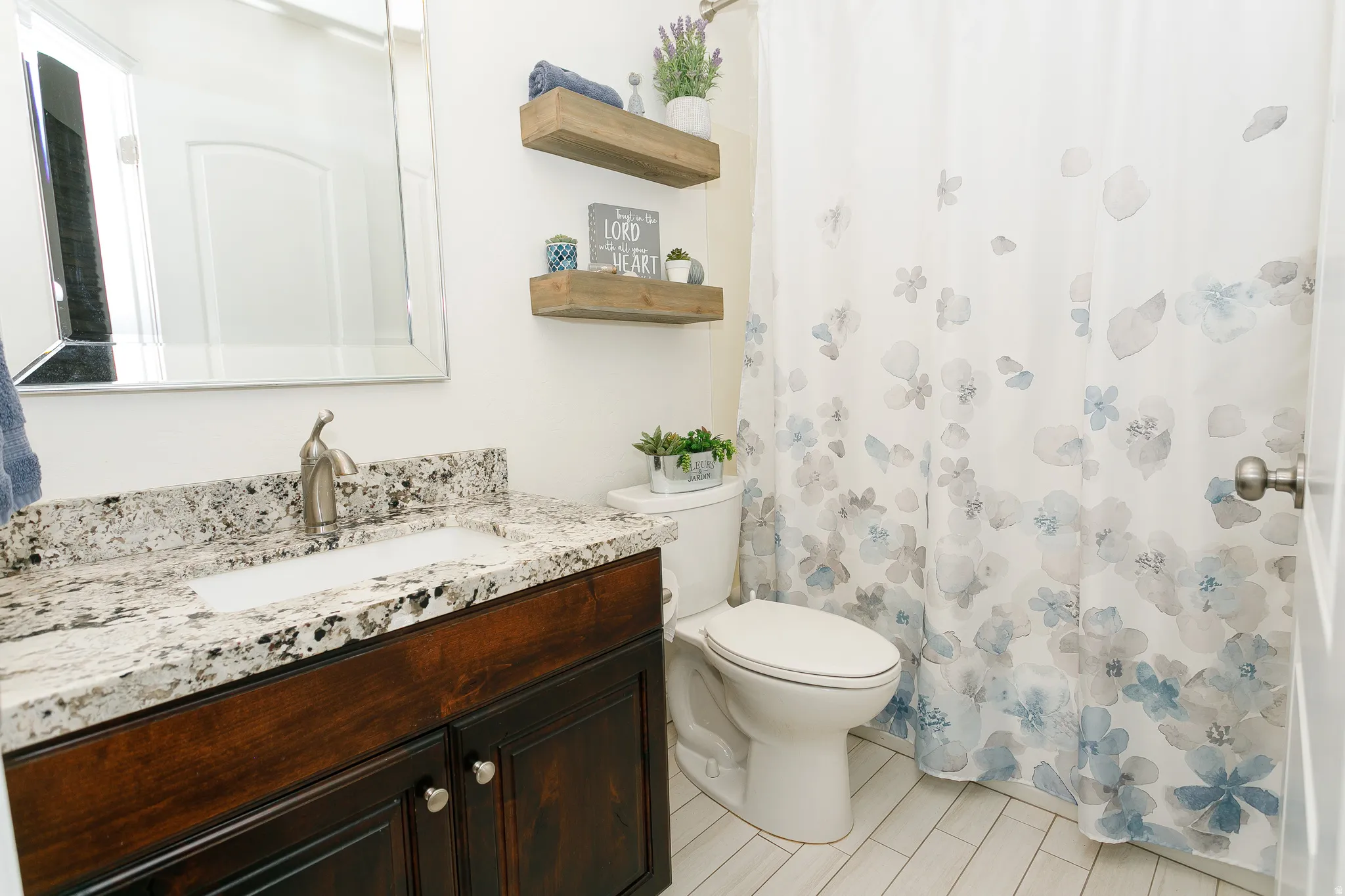 Full bath with vanity and a shower with curtain