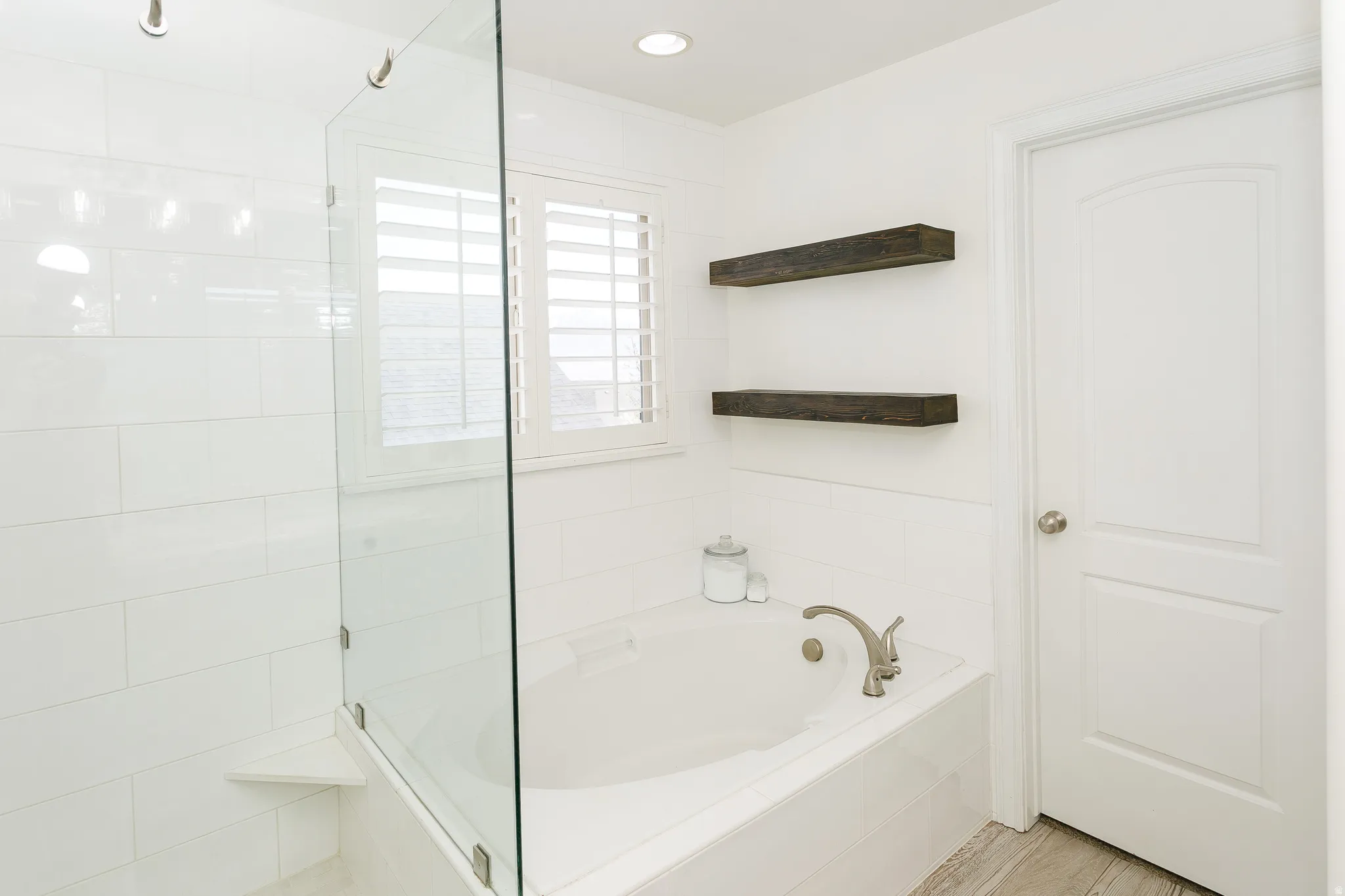 Full bath featuring a garden tub, a tile shower, and recessed lighting