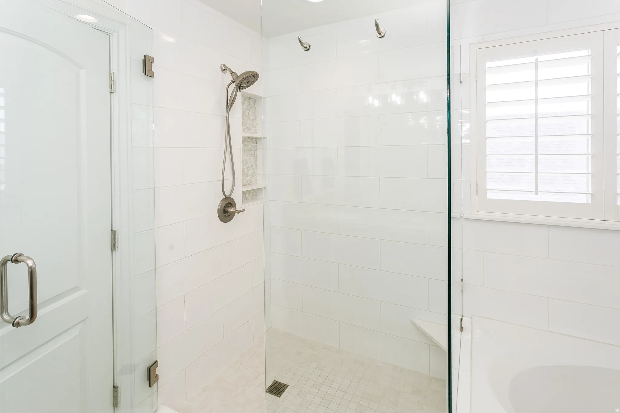 Full bathroom with a stall shower and a bath