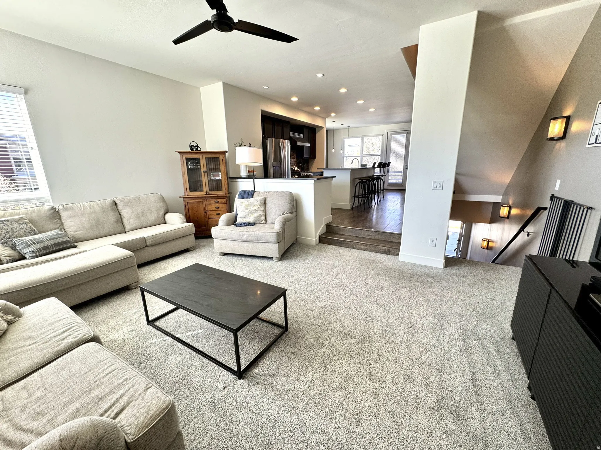 Row-end unit allows for extra windows and Wasatach mountain views. Spacious & connected to the Kitchen