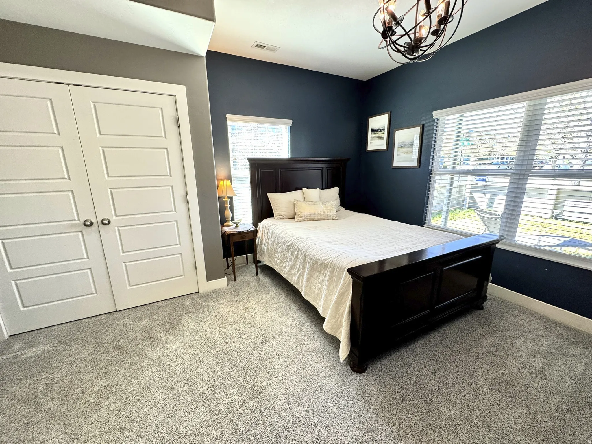 Bedroom on first level with BIG windows looking out on the patio and park. Private bathroom with tub/shower!