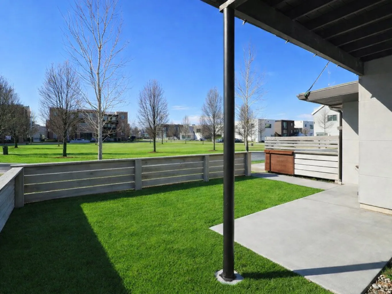 Fenced patio & yard overlooking the neighborhood park.