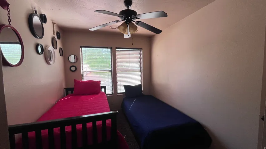 Bedroom featuring a ceiling fan