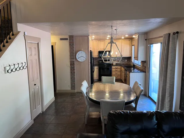 Dining space featuring stone tile floors and a textured ceiling