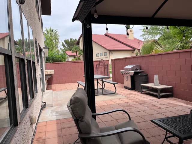 Fenced backyard featuring a patio, area for grilling, and outdoor dining area