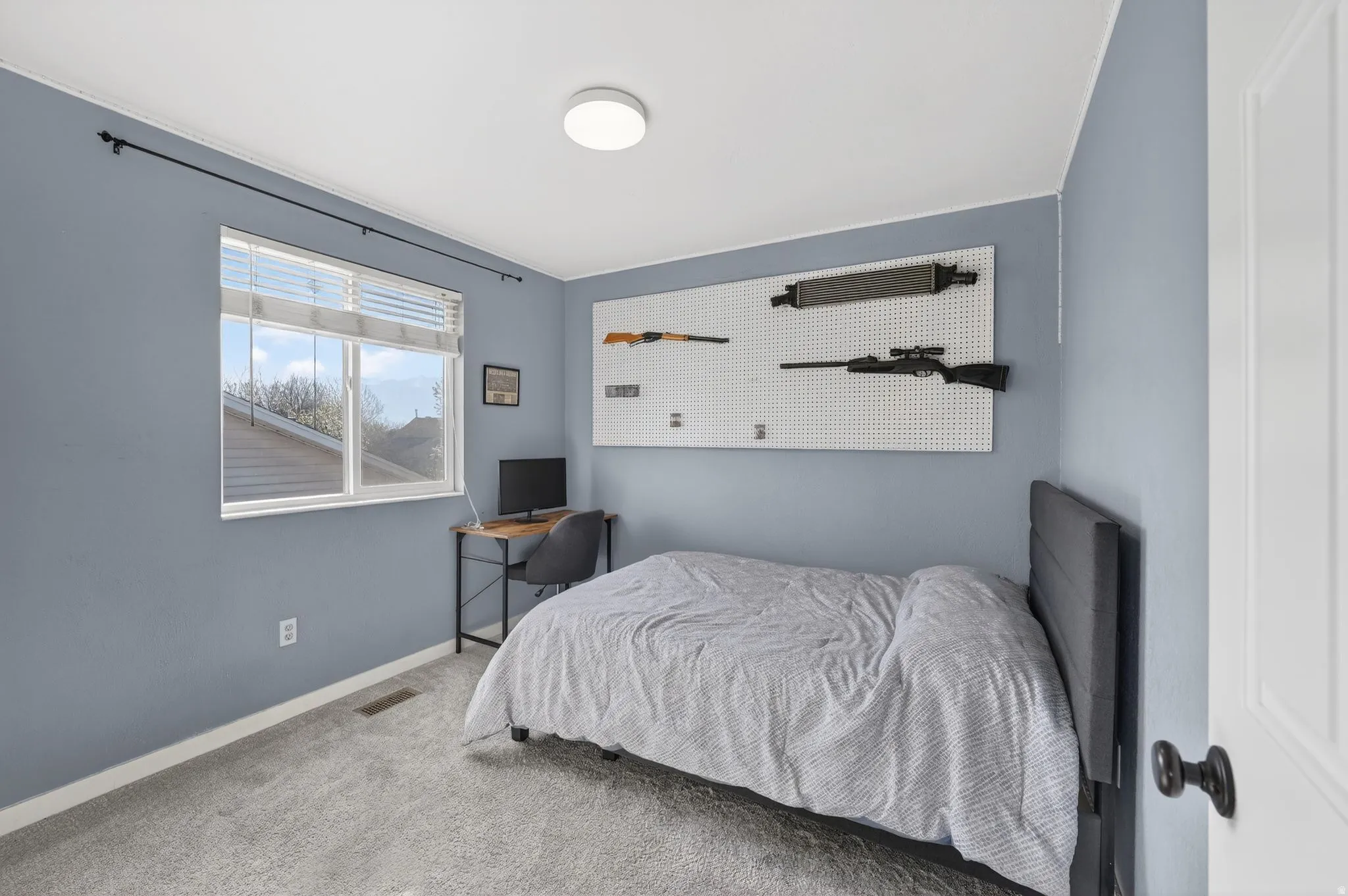 Bedroom with carpet flooring and baseboards