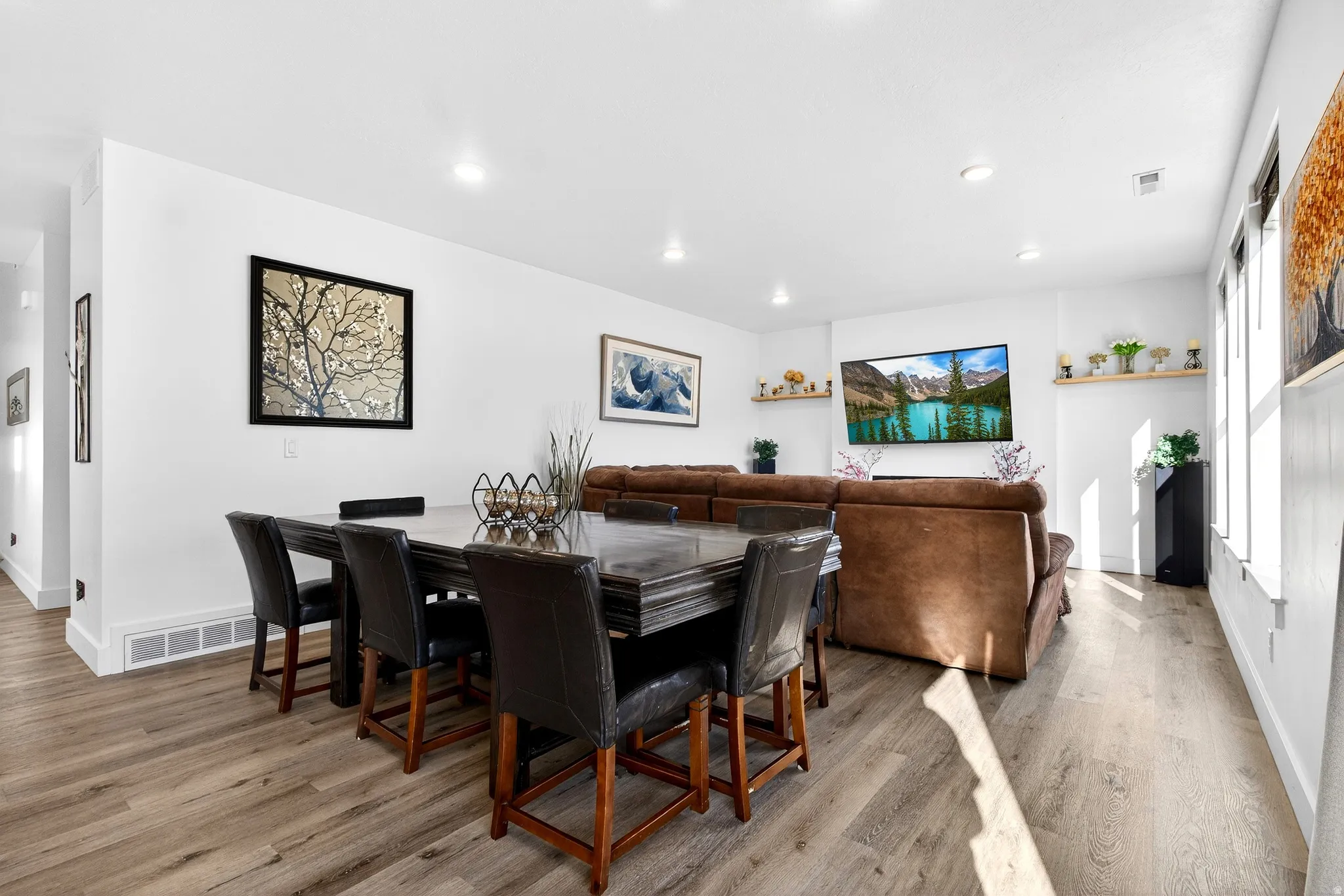 Dining room featuring light wood-style flooring and recessed lighting