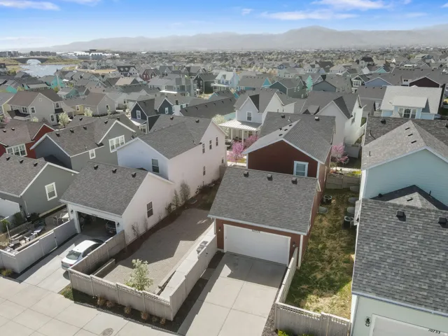 Aerial perspective of suburban area featuring a mountainous background