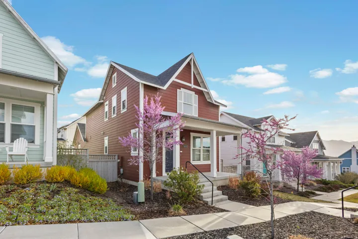 View of front of home featuring covered porch and a residential view