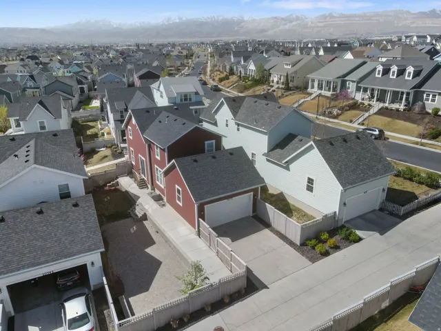 Aerial view of residential area featuring a mountain backdrop