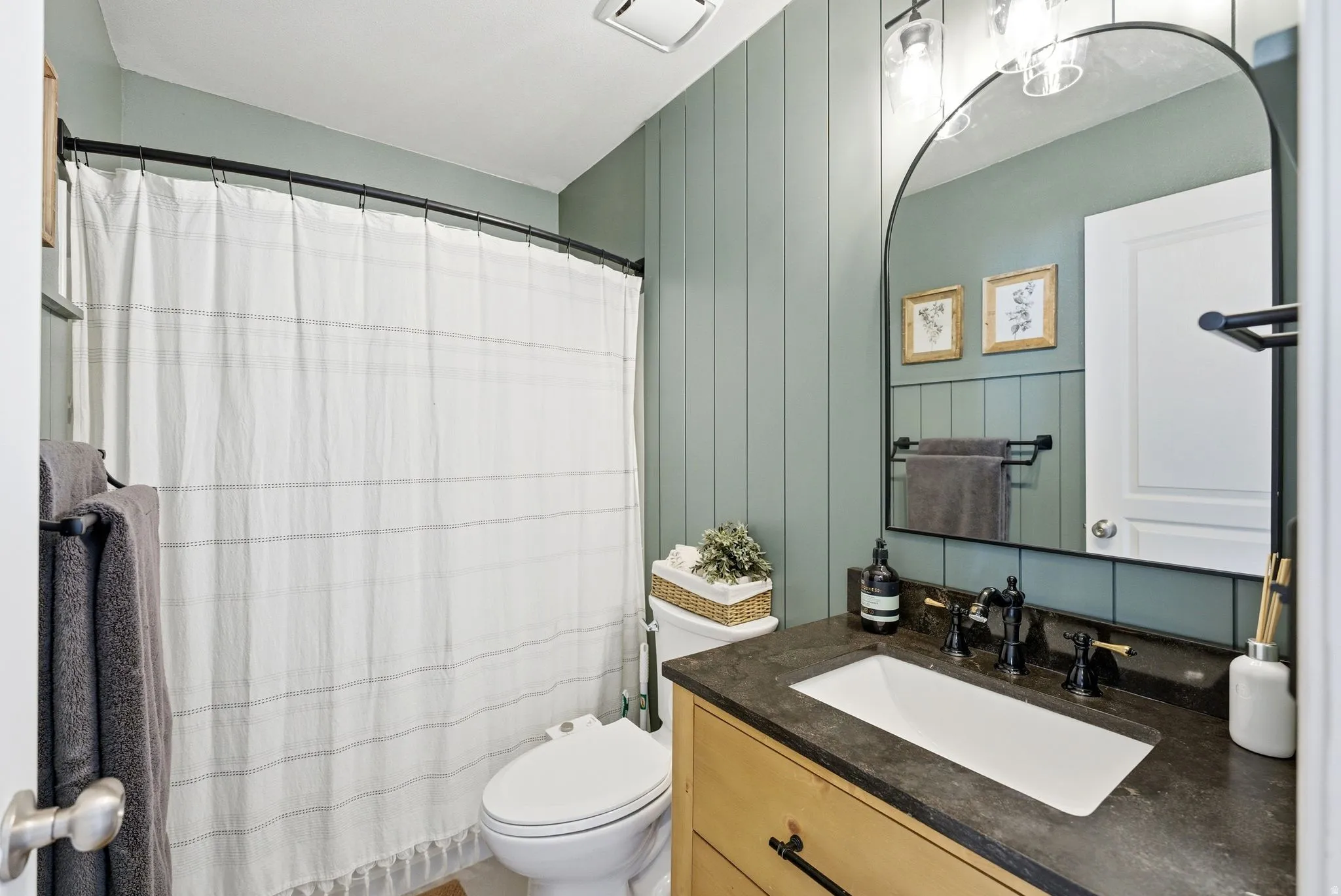 Bathroom with vanity and a shower with curtain
