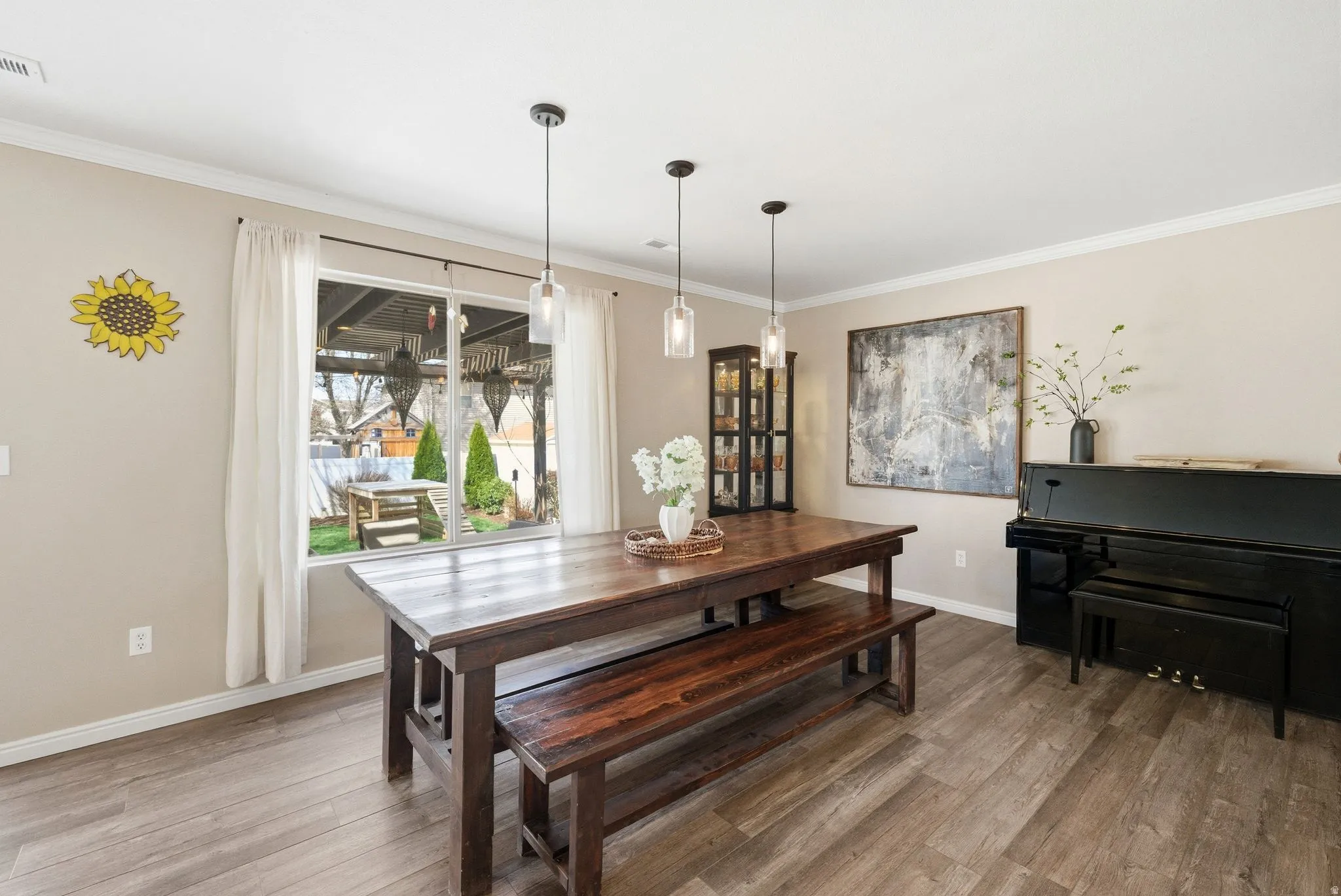 Dining room featuring crown molding and light wood-style flooring