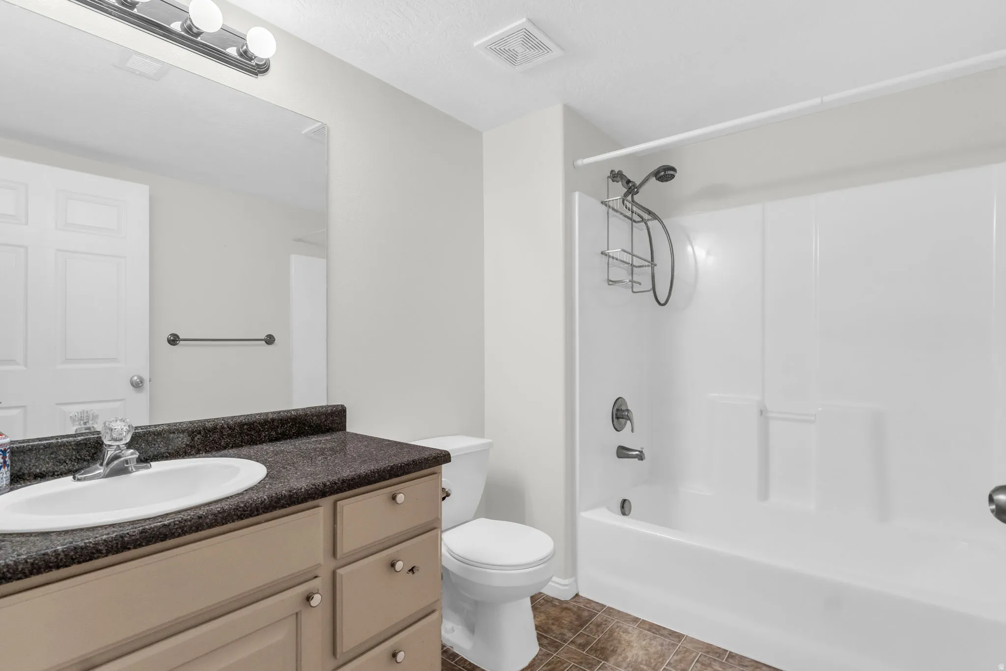 Bathroom with vanity and shower / bathtub combination