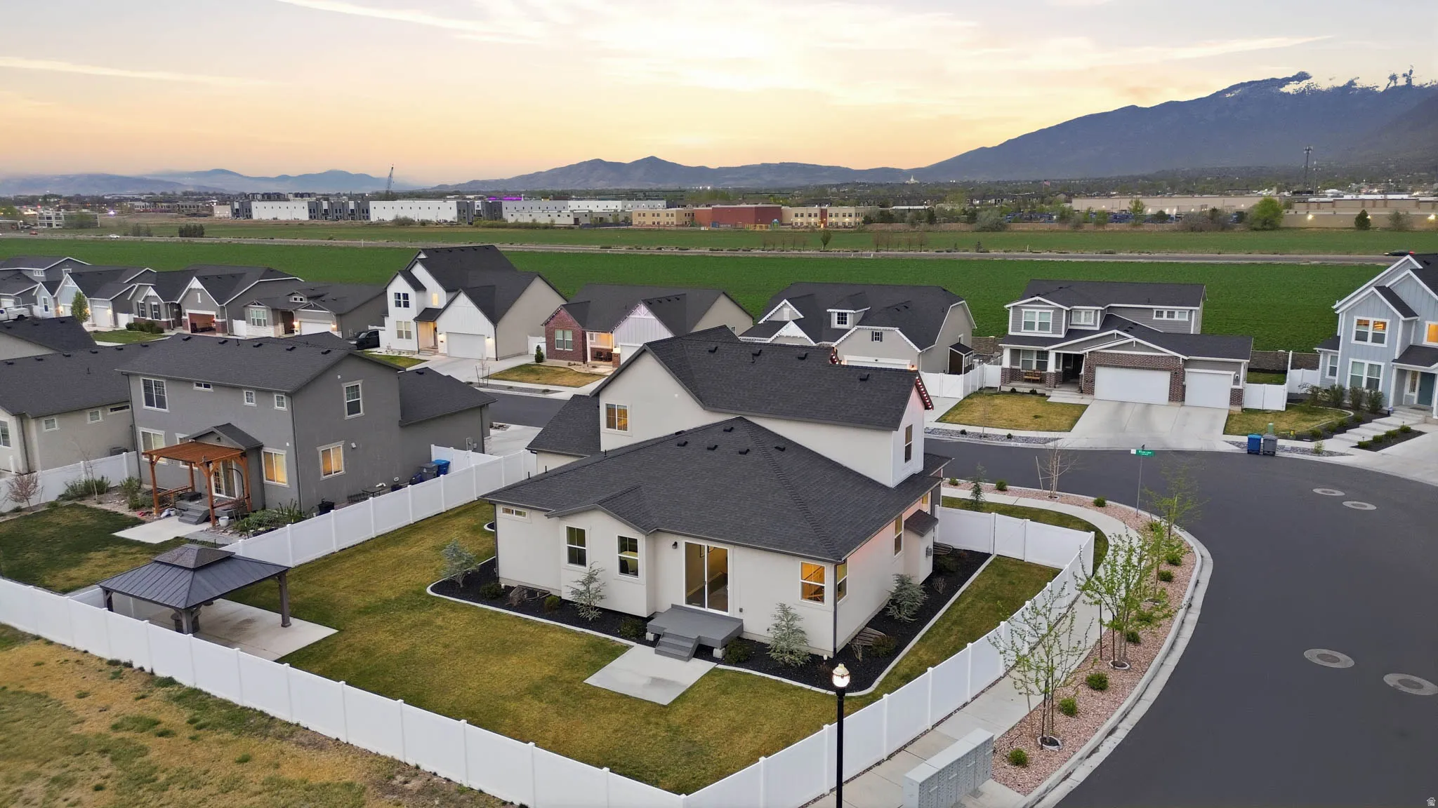 Aerial view of residential area featuring a mountain backdrop