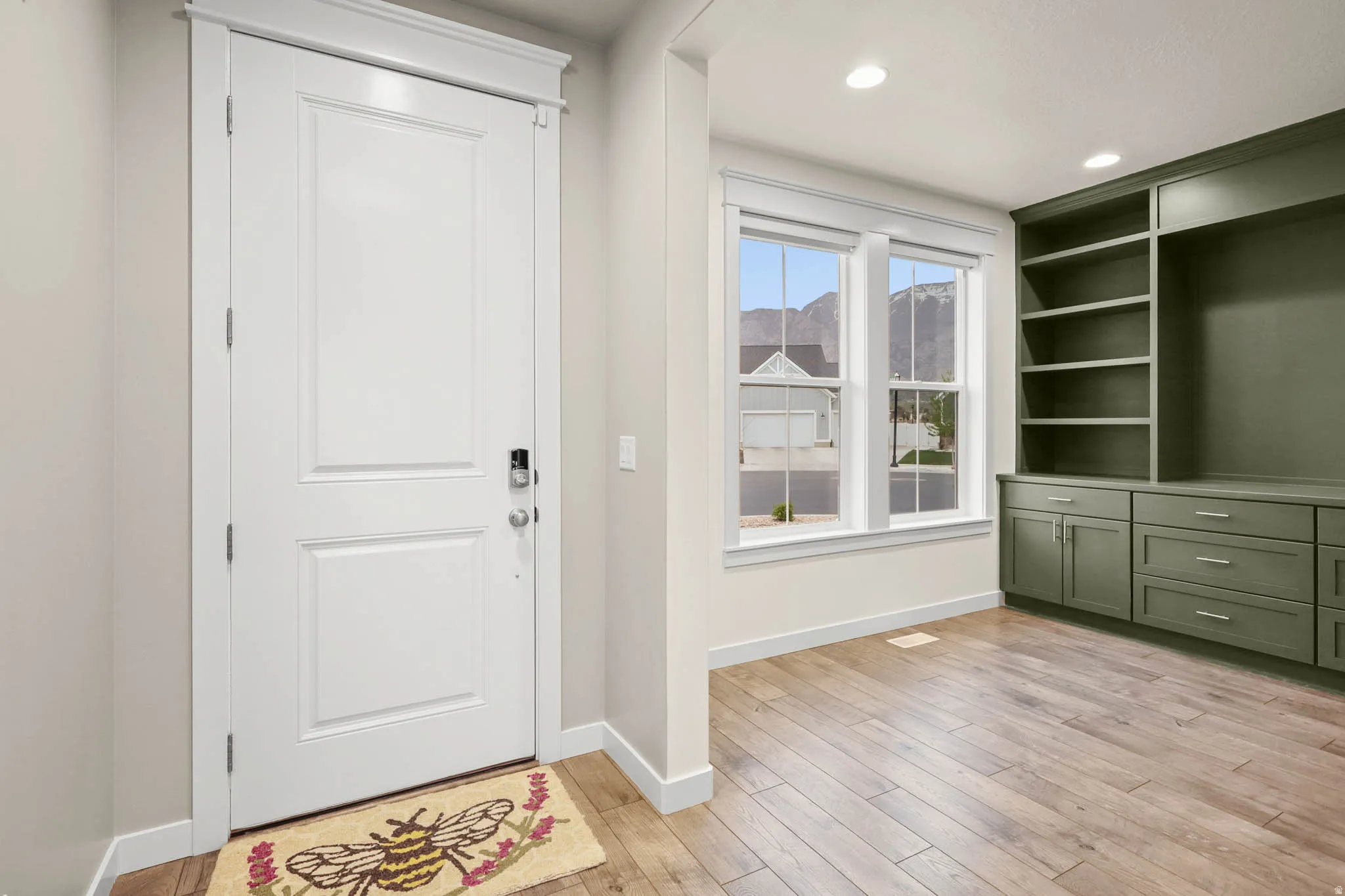 Entryway featuring light LVP floors and recessed lighting