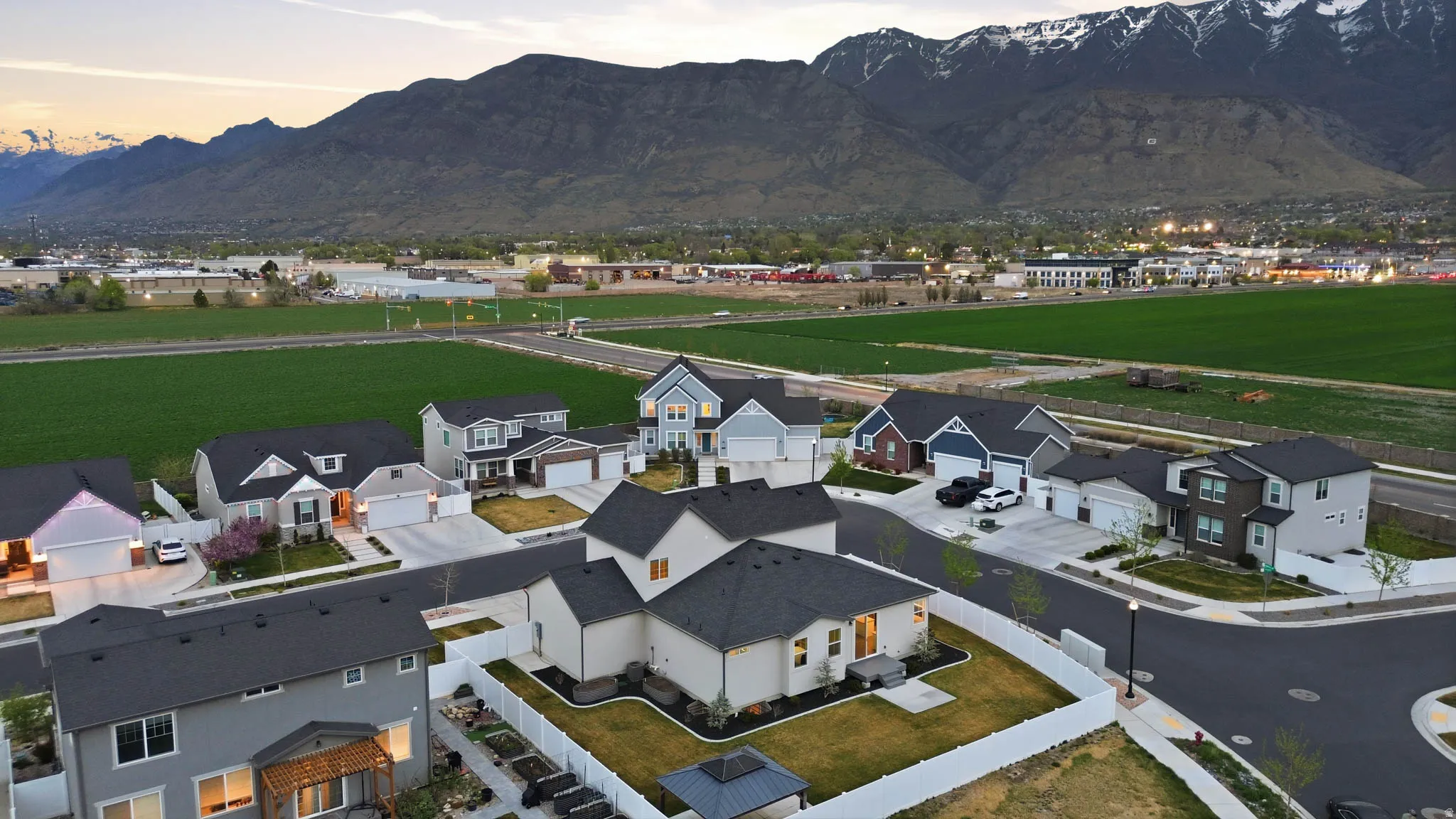 Aerial view of residential area featuring a mountainous background