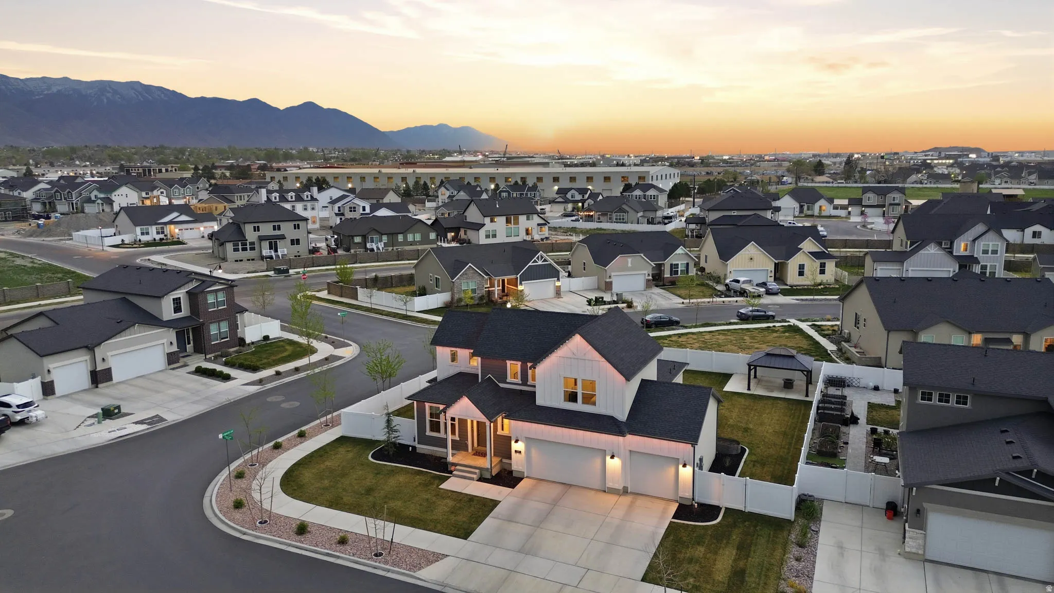 Aerial view at dusk of a residential view and a mountain view