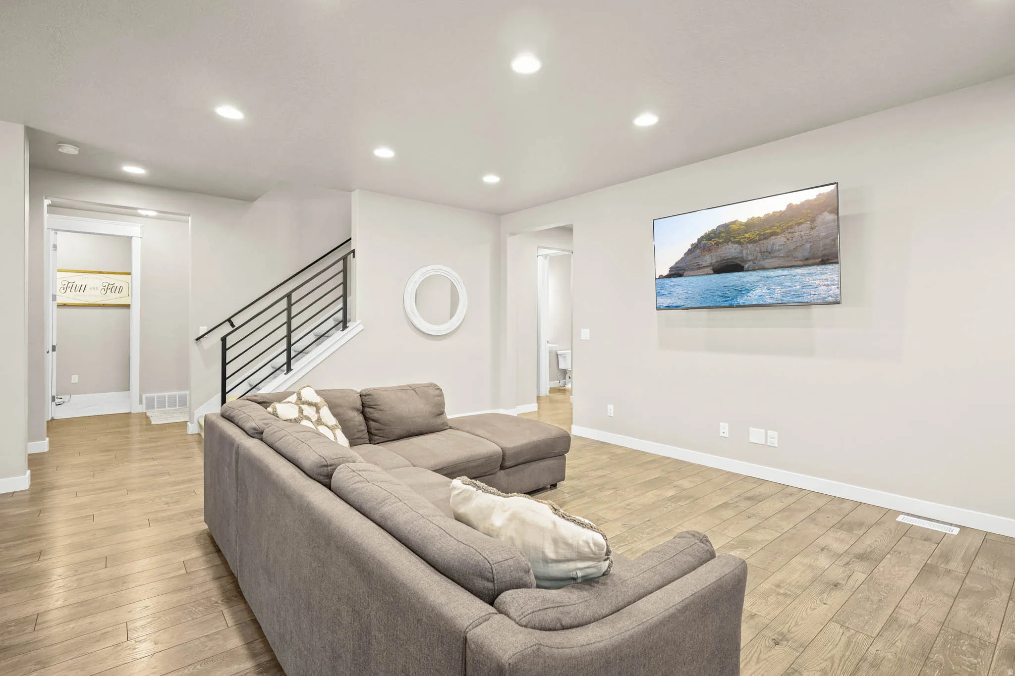 Living room featuring recessed lighting and light wood-type flooring