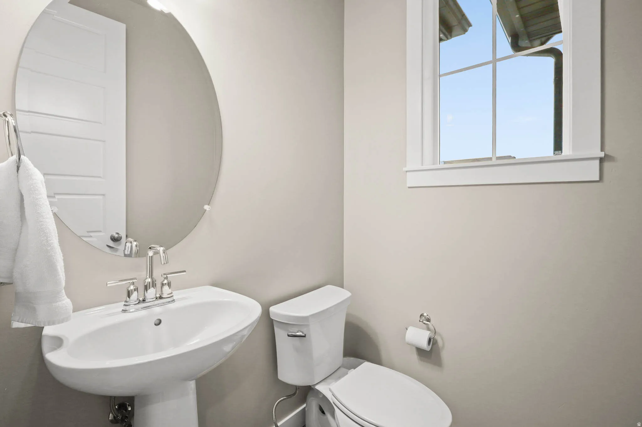 Half bath with toilet and a sink