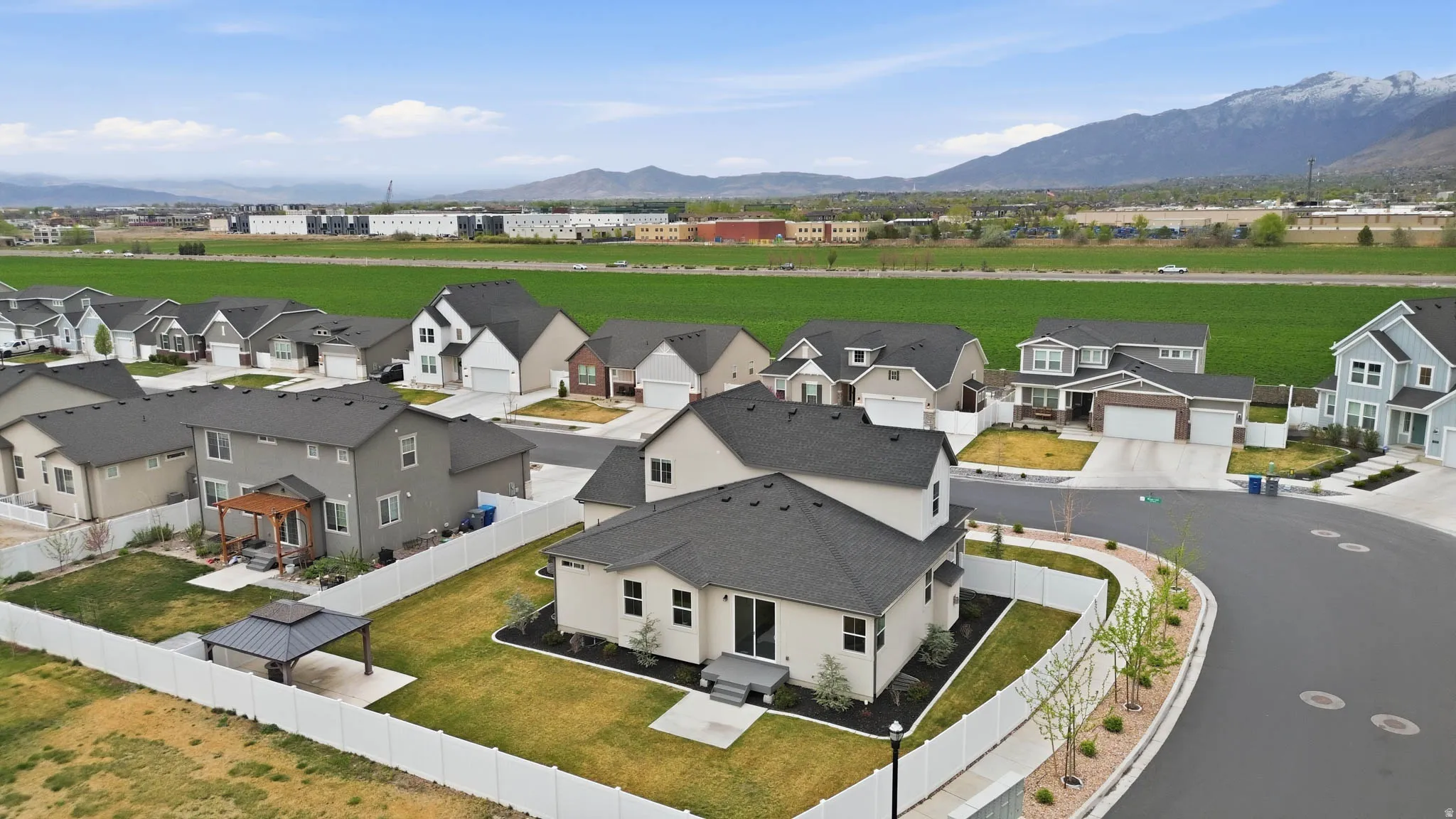 Aerial view of residential area featuring mountains