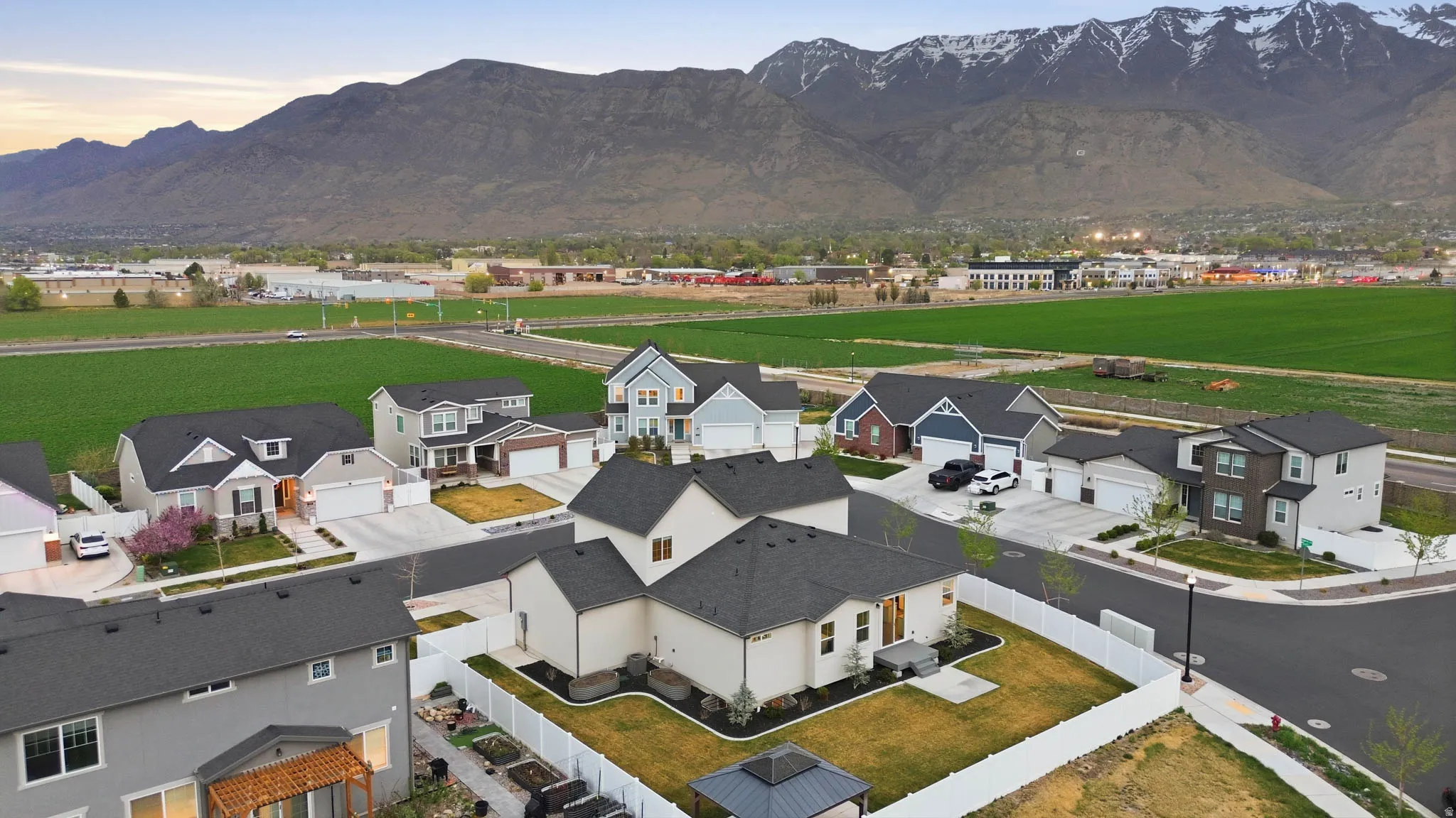 Aerial view of residential area featuring a mountain backdrop