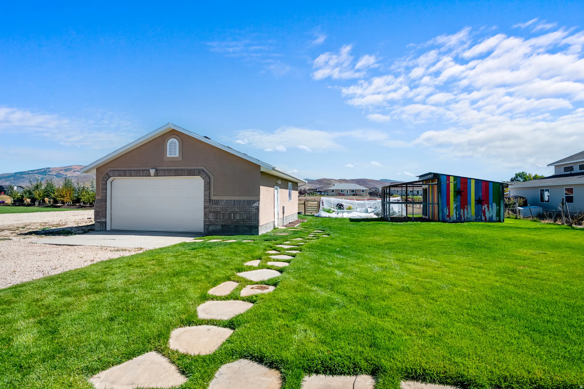 View of yard with an outdoor structure and a mountain view