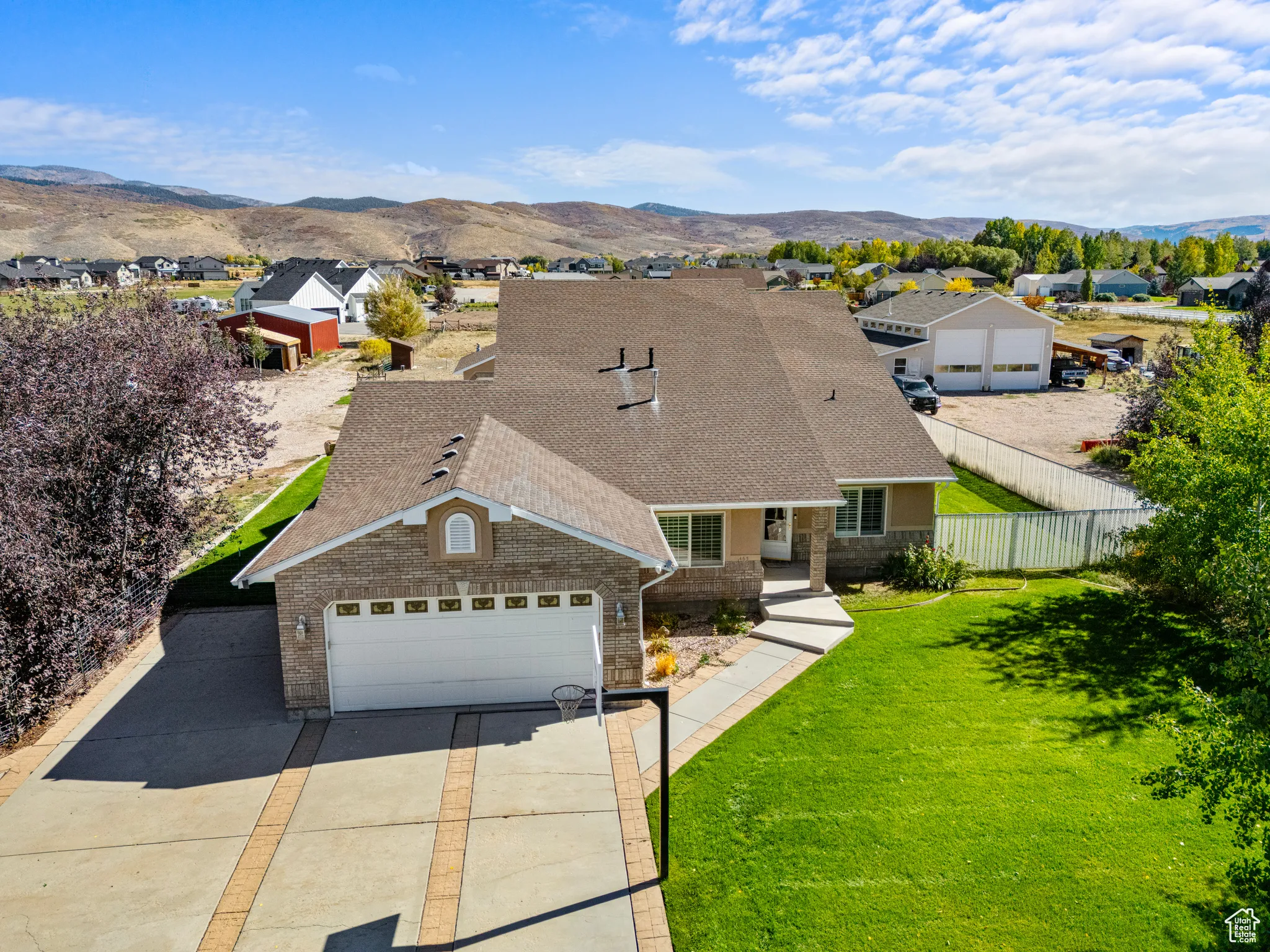 Aerial view of residential area with a mountainous background