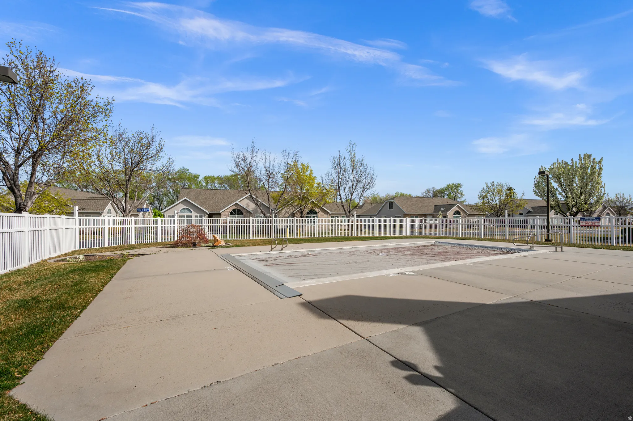 Fenced backyard with a residential view