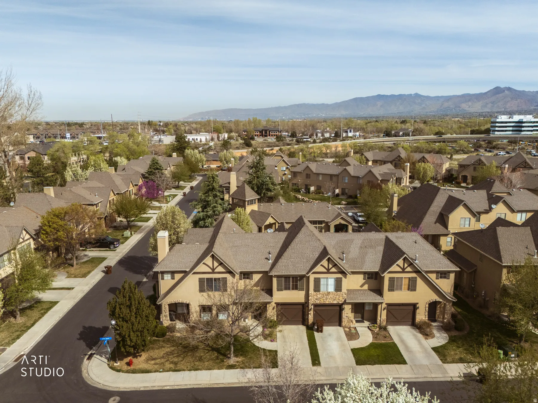 Aerial view of residential area with a mountainous background