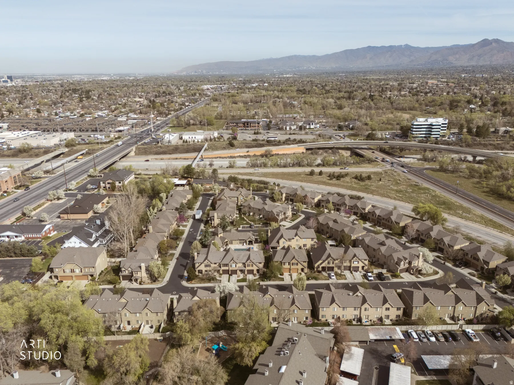 View of property location featuring nearby suburban area and a mountainous background