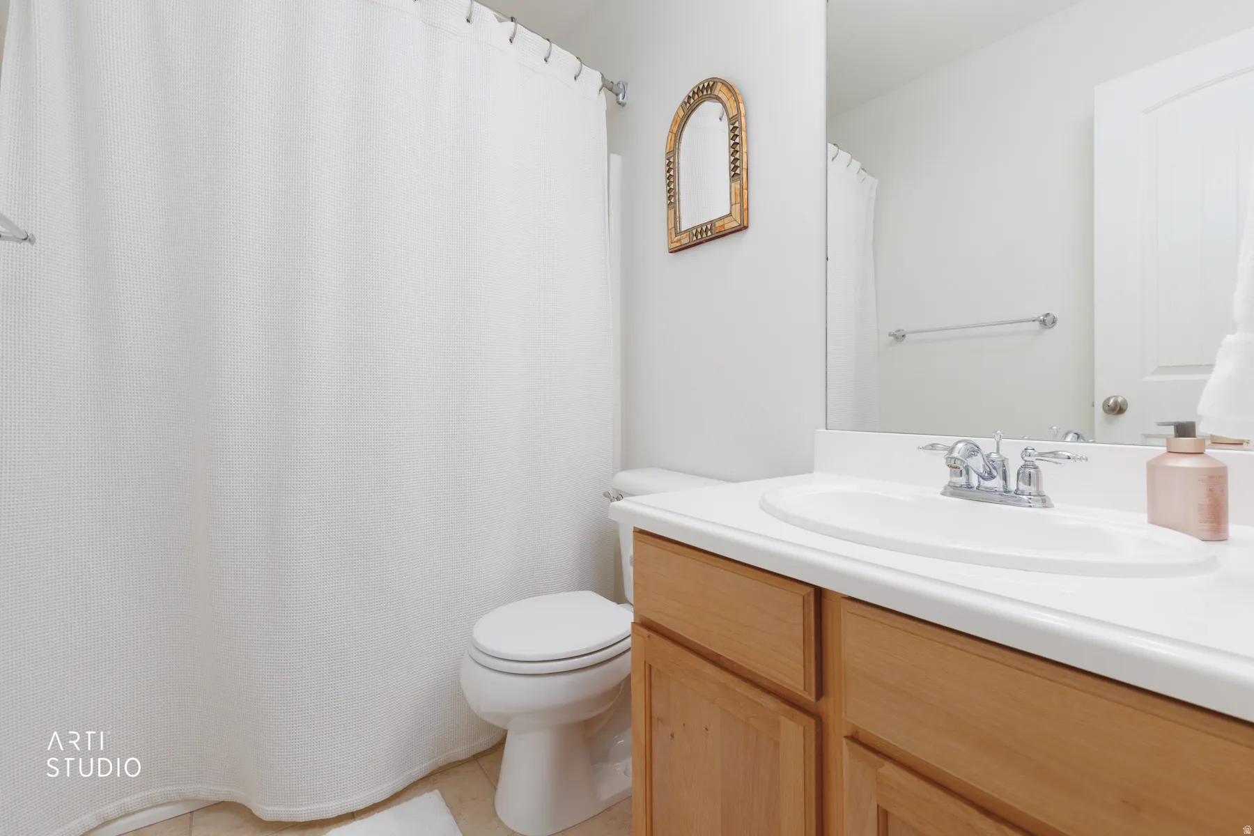 Bathroom featuring vanity and a shower with shower curtain