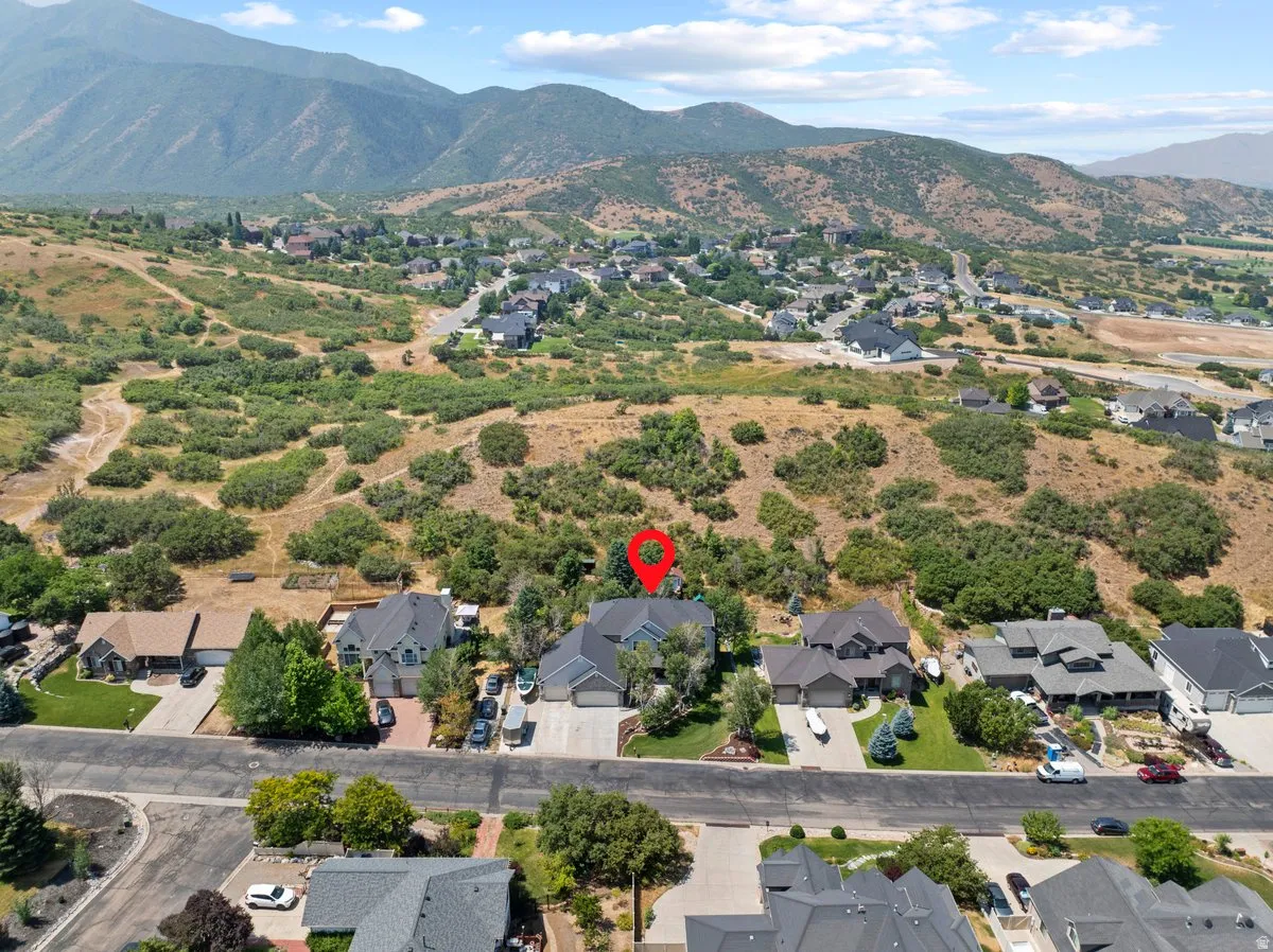 Aerial view of property and lot with surrounding area with the nearby mountains