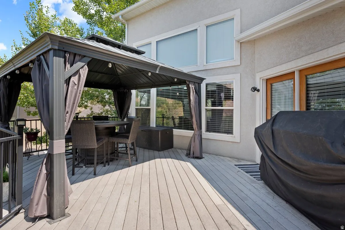 Spacious deck is perfect for entertaining and offers serenity and beautiful views!