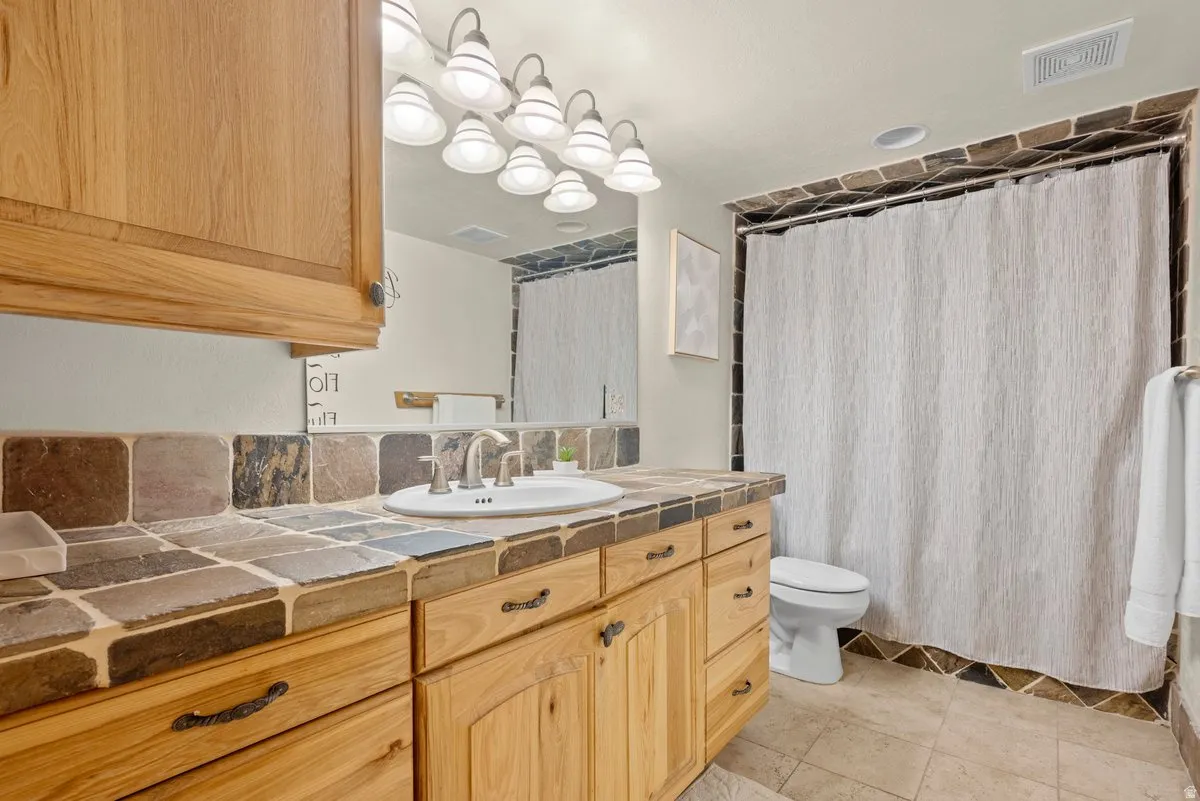 Full bathroom with tub and shower