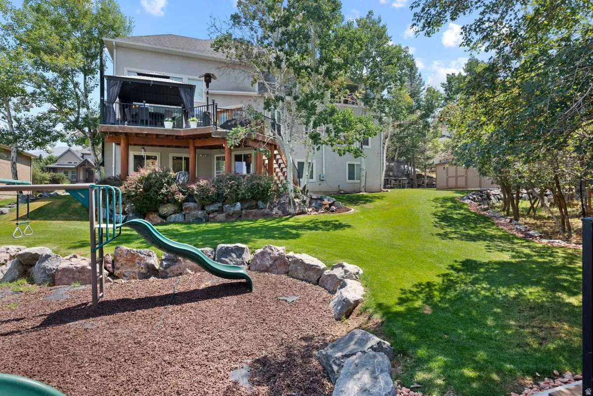 Back of property showing the deck and covered patio