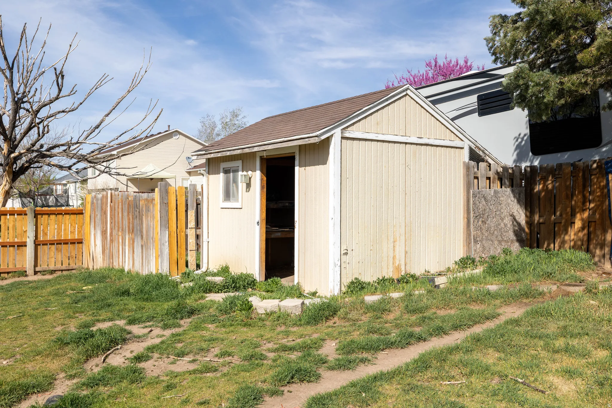 View of shed featuring a fenced backyard