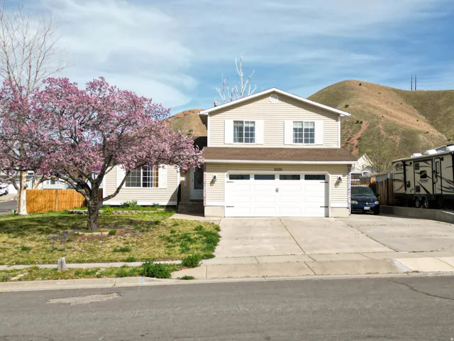 Traditional-style house featuring driveway and a garage