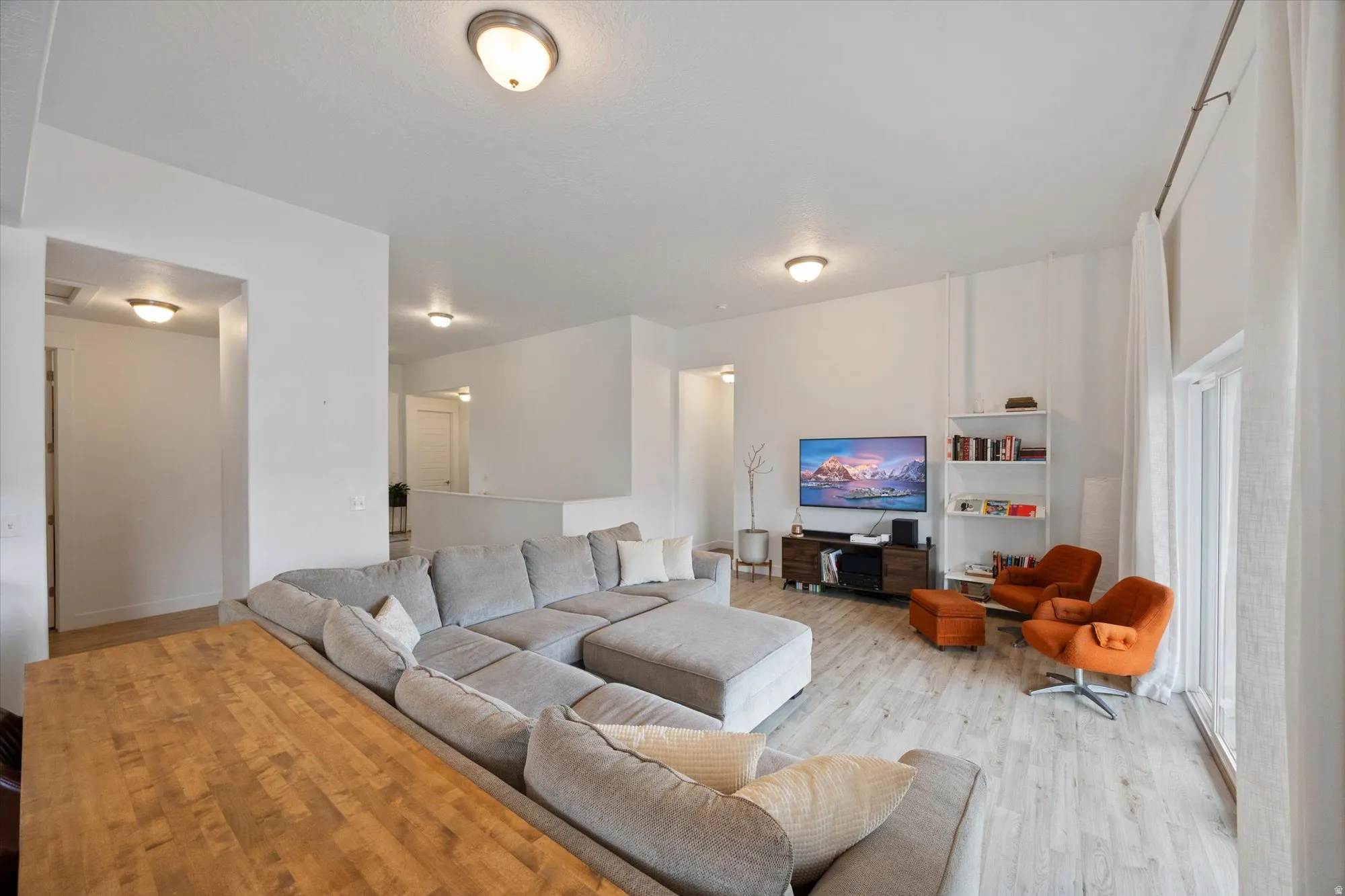 Living area featuring light wood-type flooring