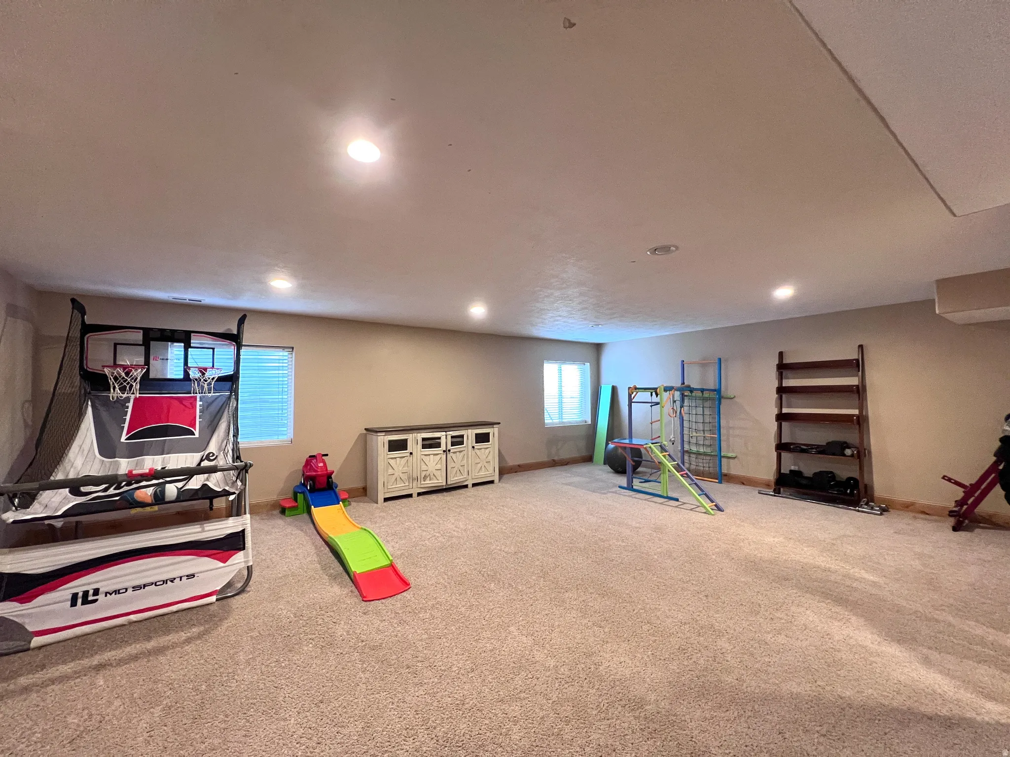 Game room featuring carpet and recessed lighting