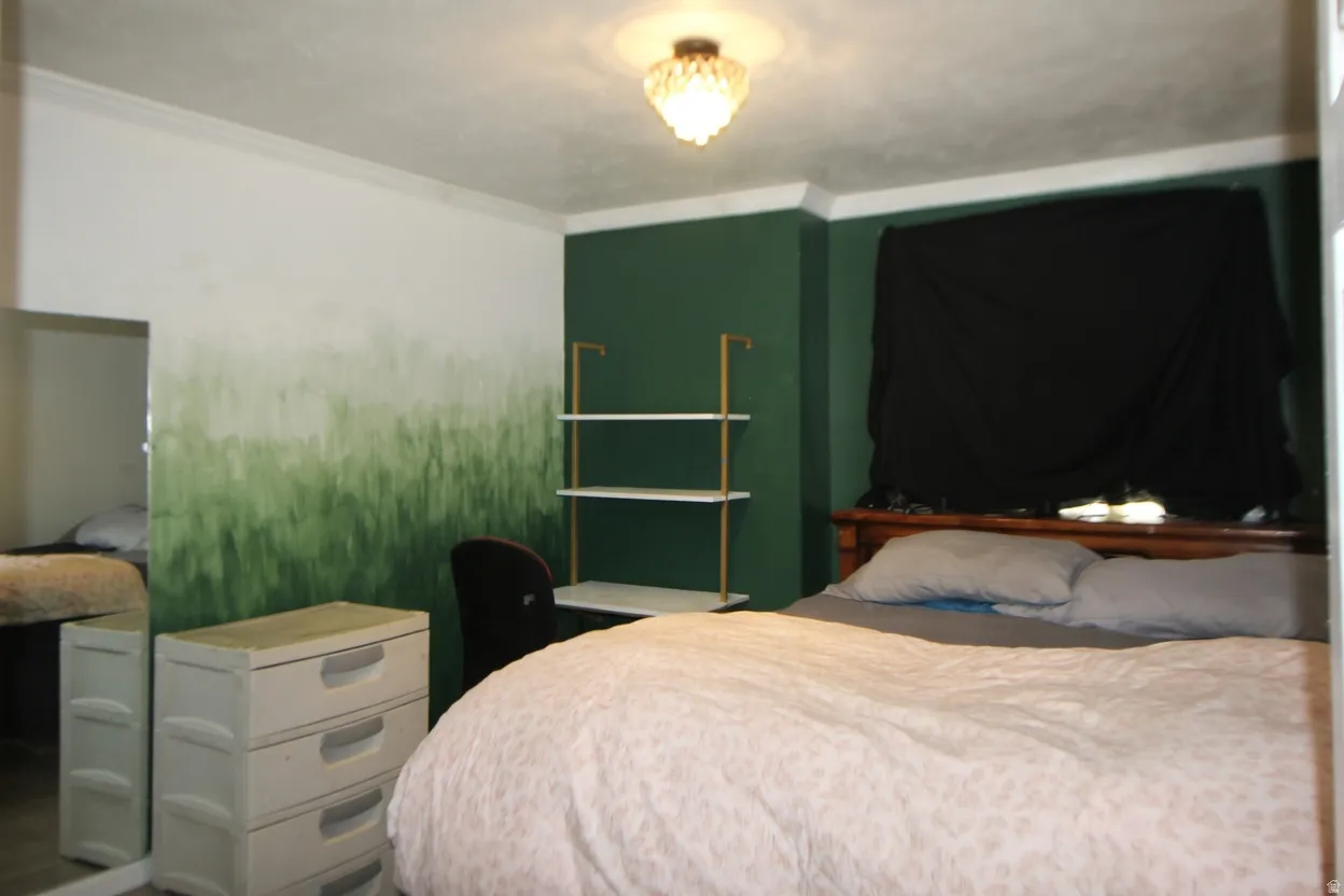 Bedroom with ornamental molding