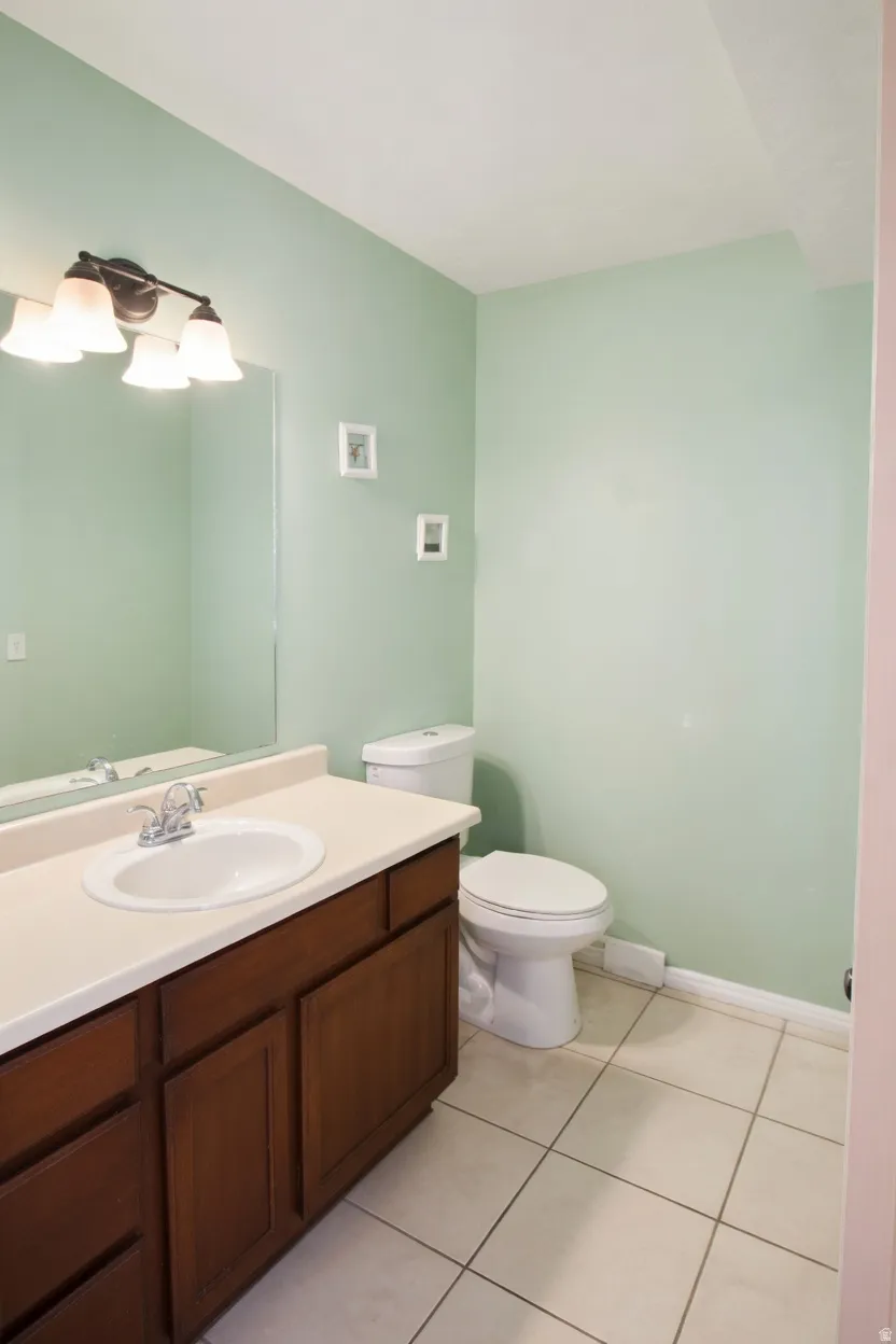 Bathroom with vanity and light tile patterned flooring