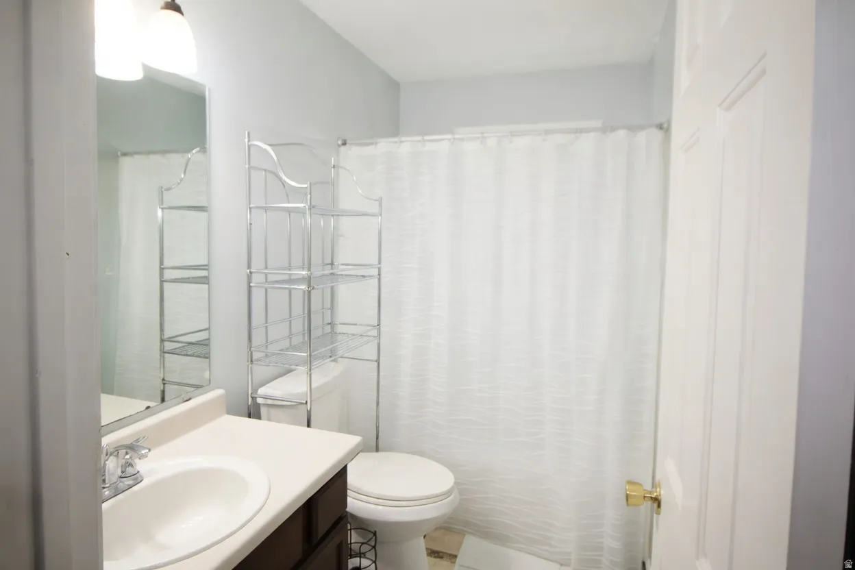 Full bath with vanity and toilet