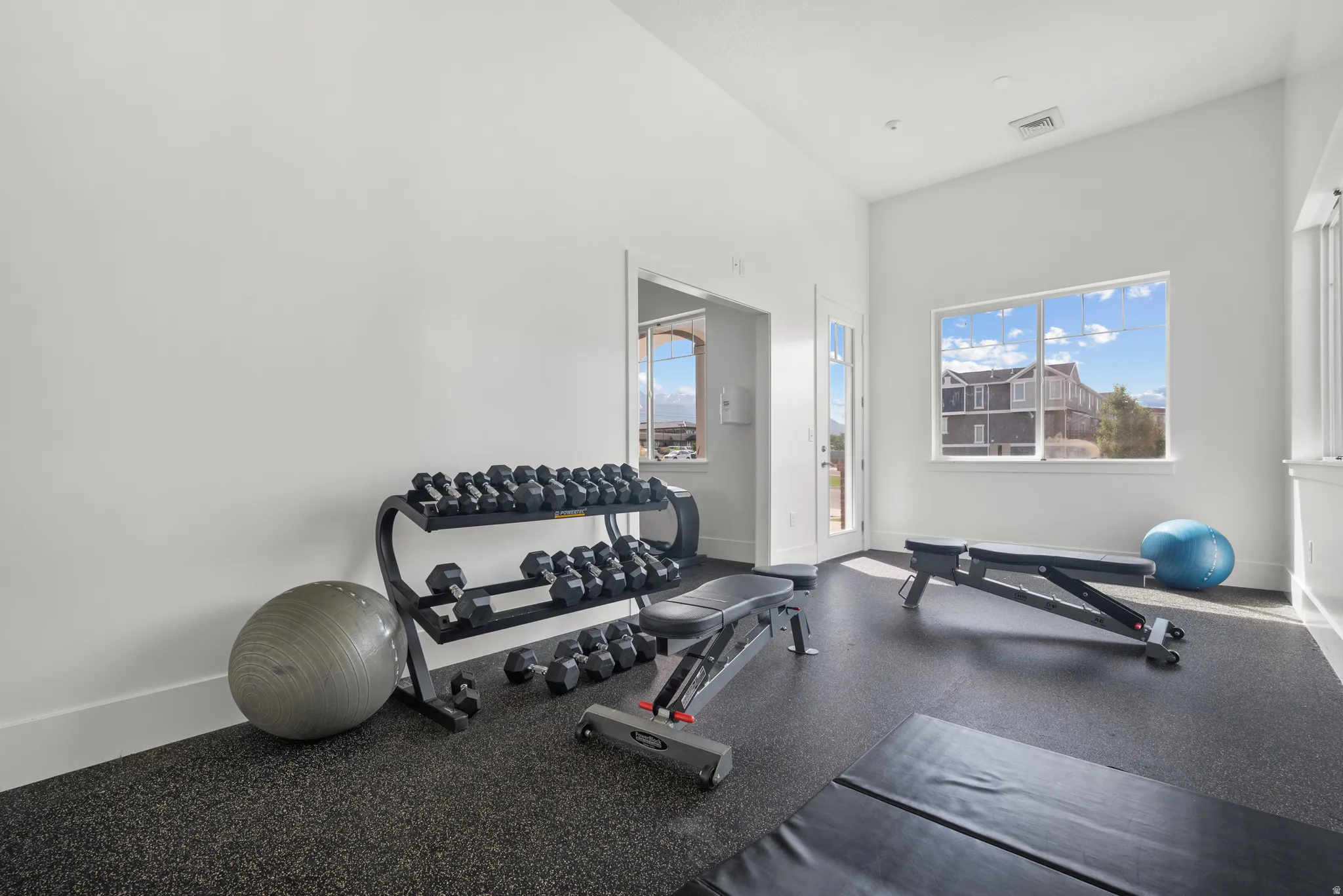 Workout area with a high ceiling