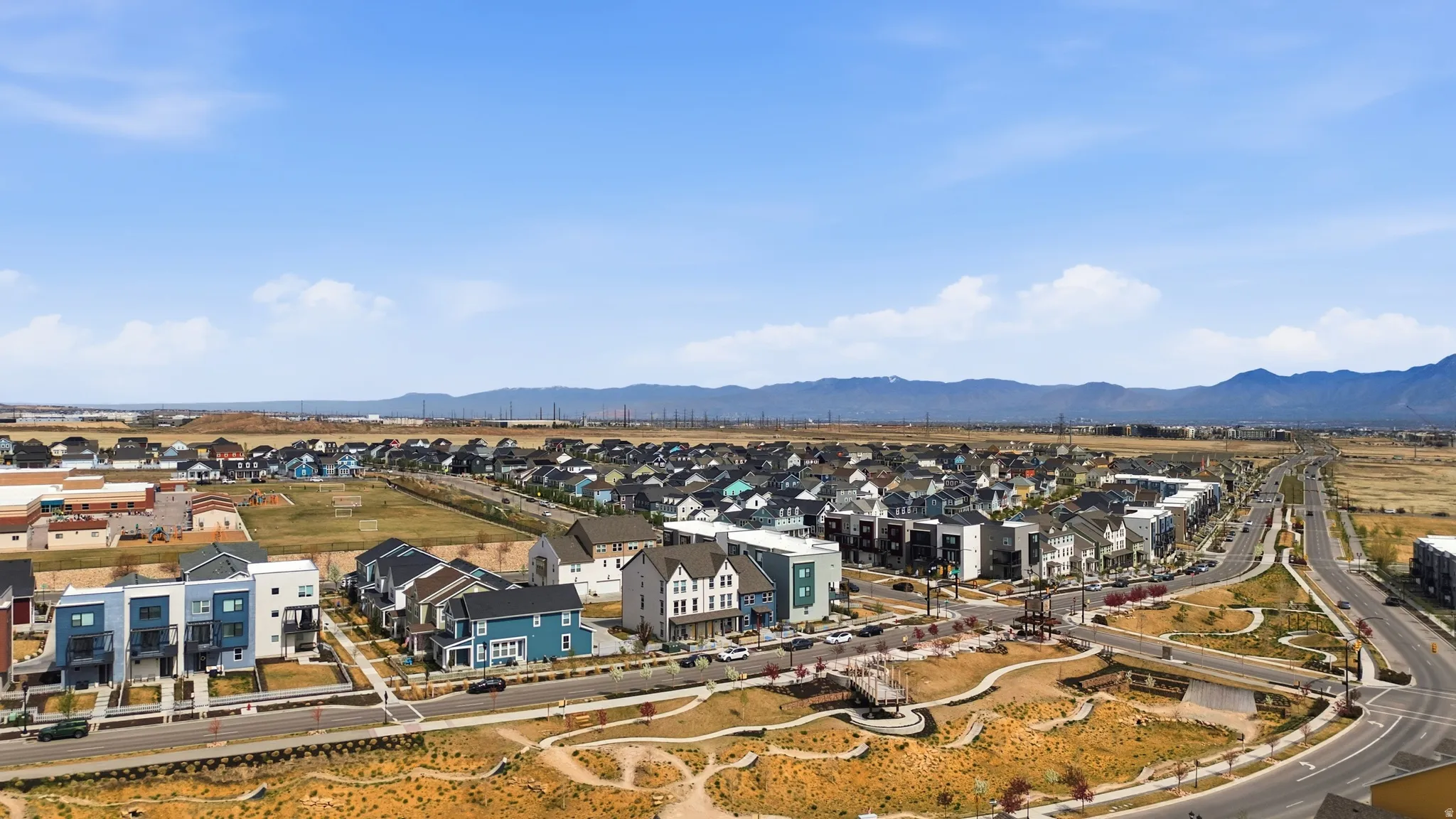 Aerial view of residential area with a mountain backdrop