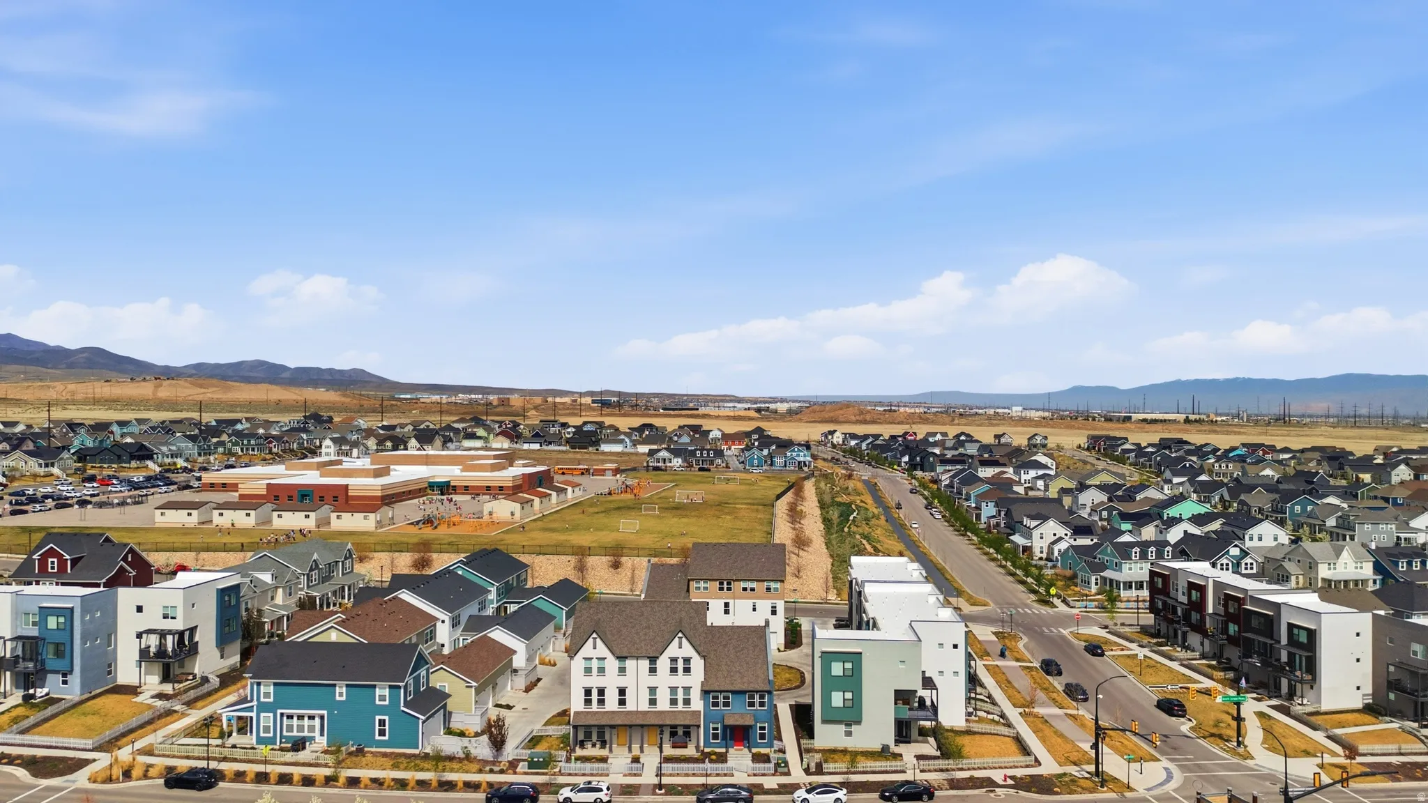 Aerial perspective of suburban area with a mountain backdrop