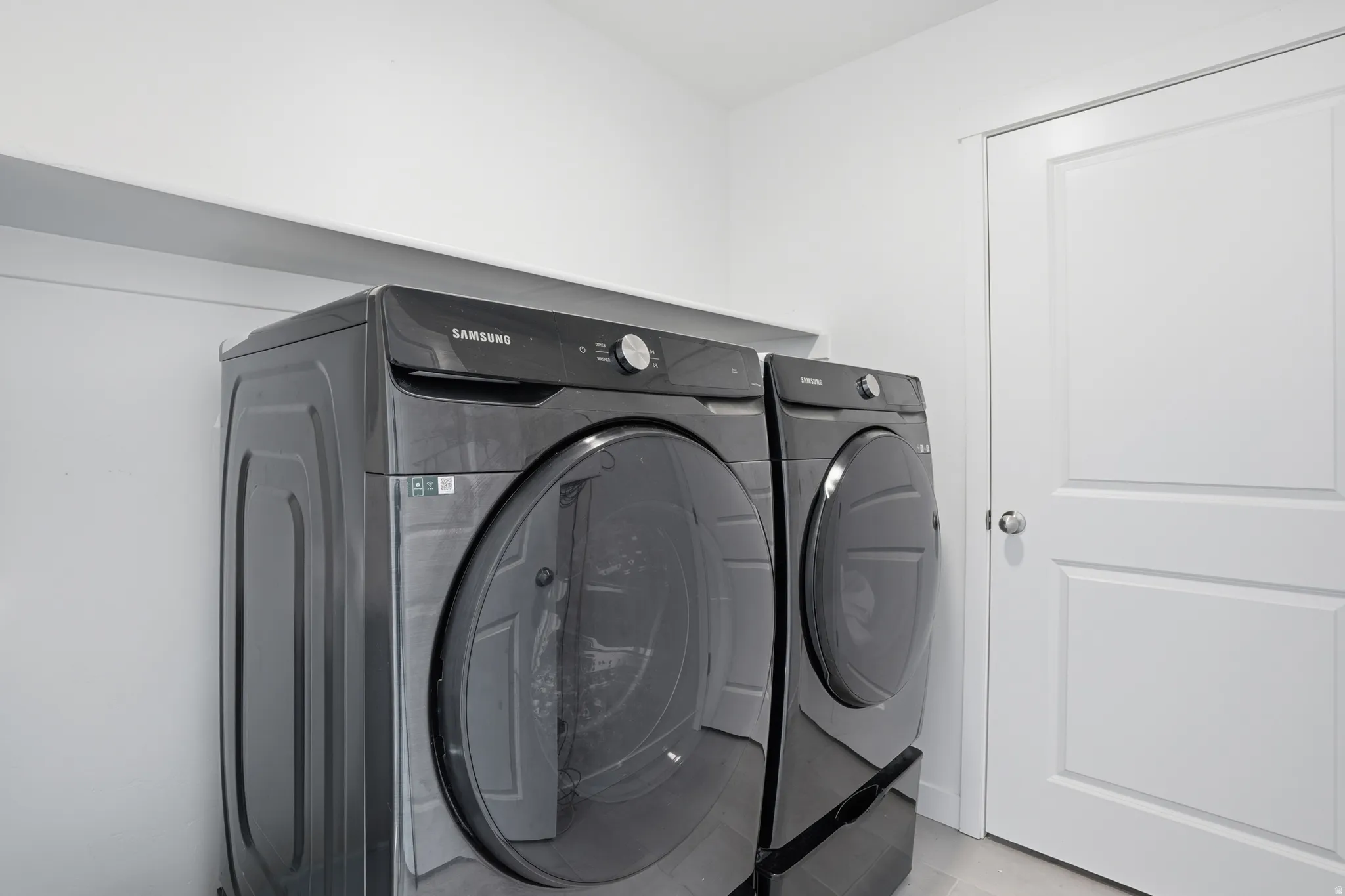 Laundry area with included washer and dryer